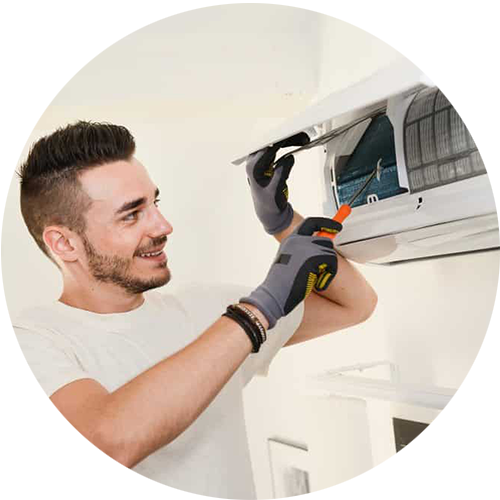 male technician servicing an air conditioner