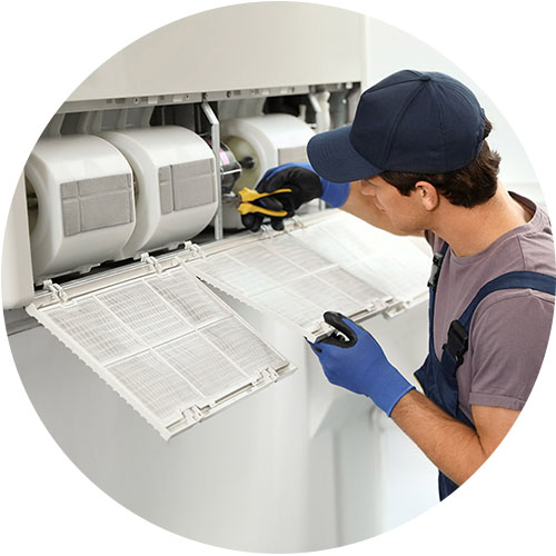 Surrey Air Technician repairing a ducted air conditioner