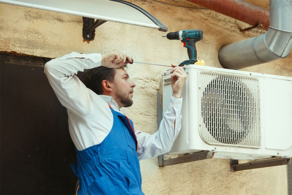 man doing Air Conditioner installation