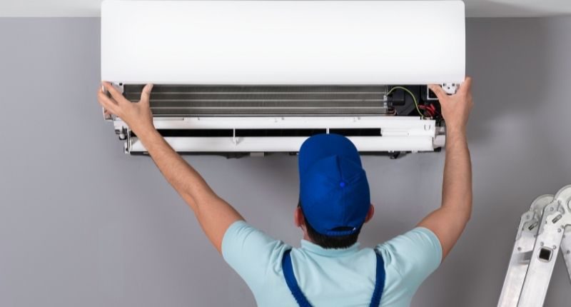 Technician doing air conditioner installation in Keysborough Melbourne