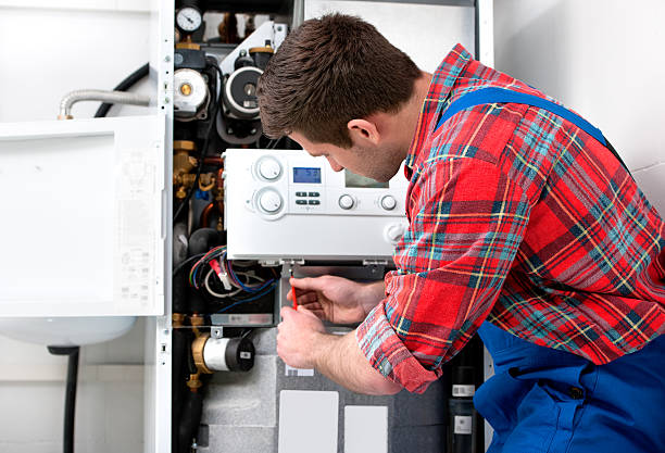Technician doing heating repair service