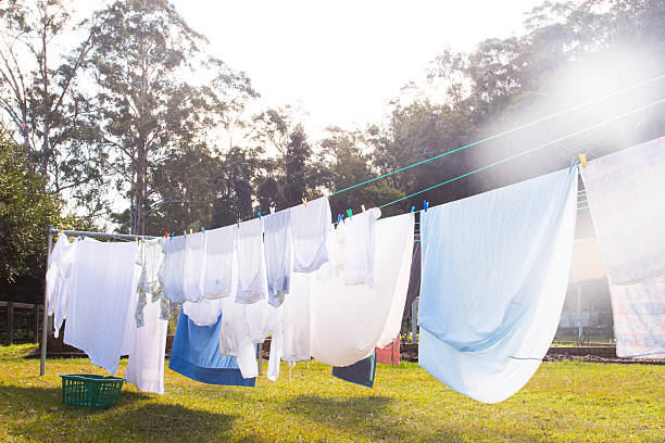Clothes hanging on clothesline outside to air dry