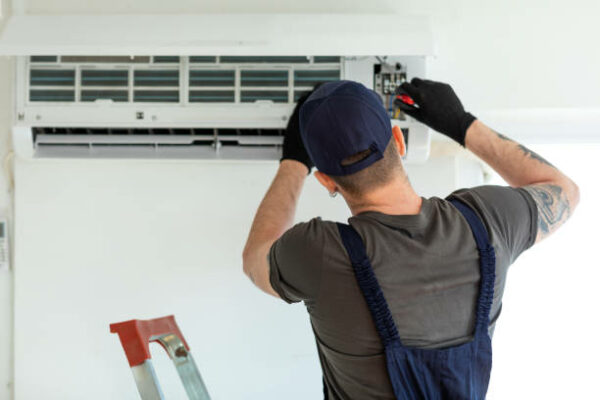 Technician doing air conditioning installation Parkdale VIC