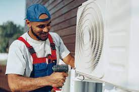 Technician doing air conditioning installation mordialloc