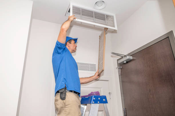 Technician showing how to clean ducted air conditioner filter Melbourne; Surrey Air Heating and Cooling 7/84-90 Lakewood Blvd, Braeside VIC 3195, Australia. 61395517460