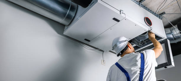 Surrey Air Technician converting ducted heating to air conditioning in Melbourne