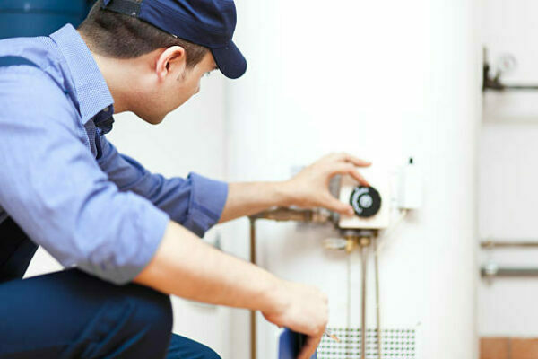 Surrey air smiling technician doing heating installation Glen Waverly