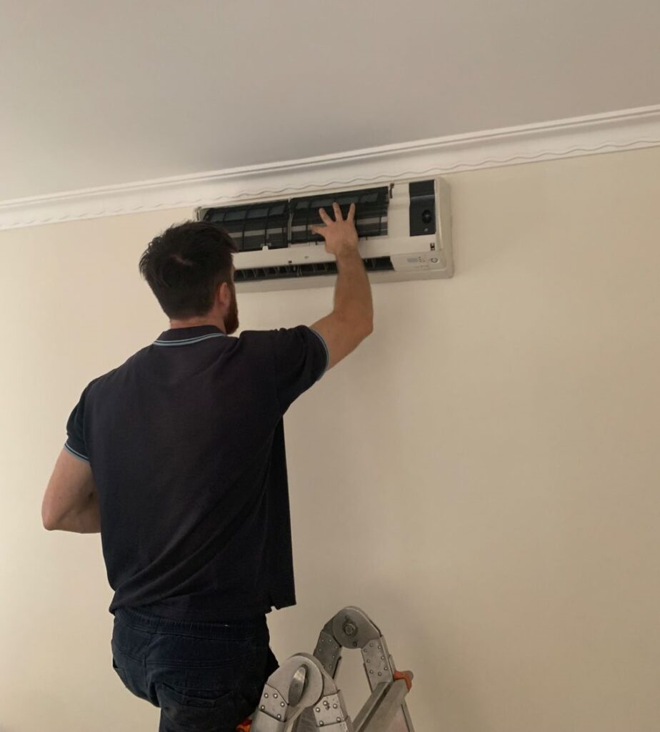 Surrey air technician doing hvac maintenance in winters