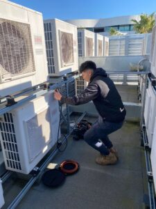 Surrey air technician making sure the air conditioner installation process remains seamless