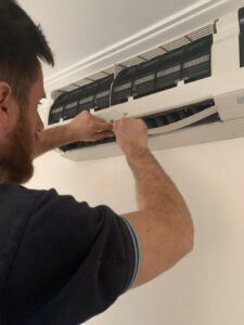 surrey air technician servicing the split system aircon