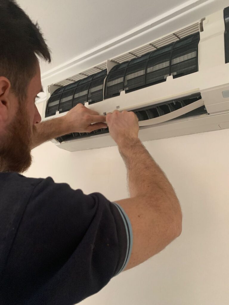 surrey air technician servicing the split system aircon