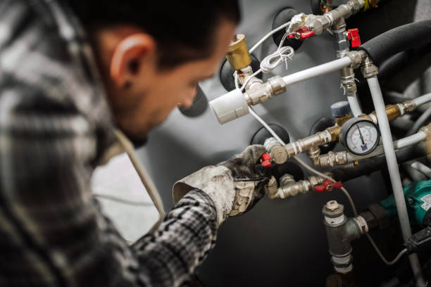technician fixing gas heater