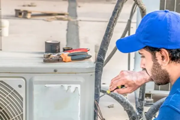 Surrey air technician doing air conditioning repair